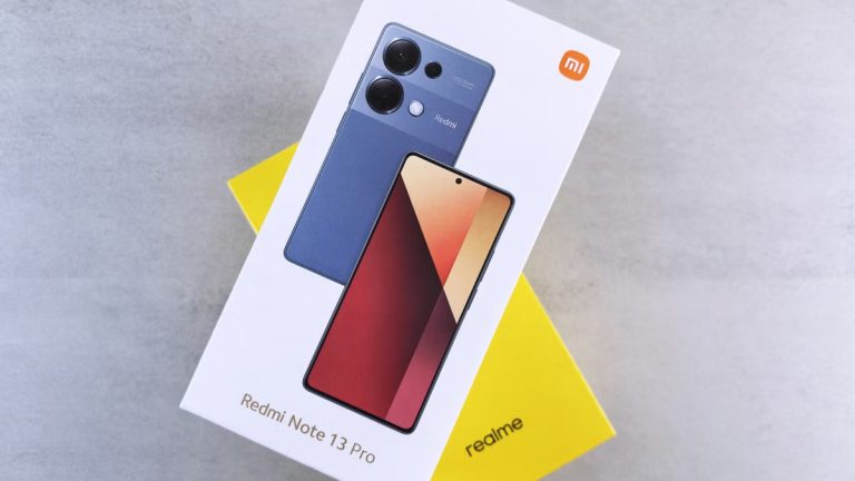 Close-up of Redmi Note 13 Pro phone box with sleek design on neutral background.